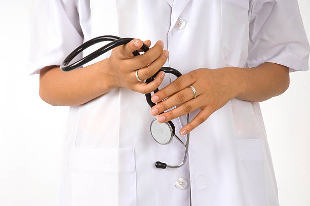 Young women holding stethoscope stock photo