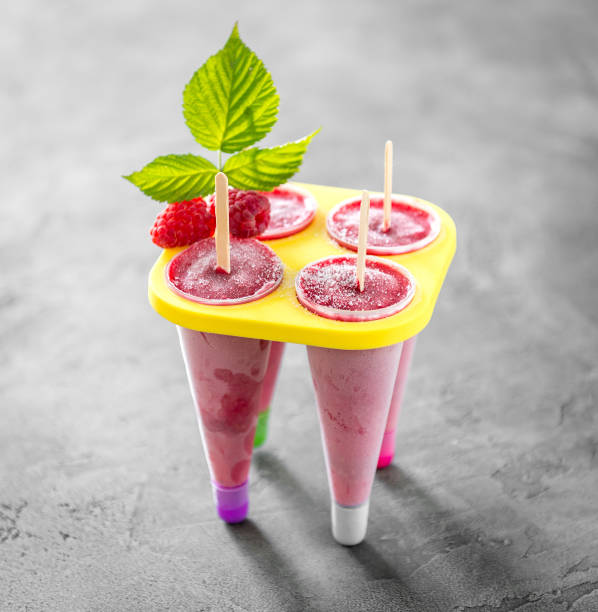 istock homemade raspberry cones standing in yellow ice-cream container 1402343861