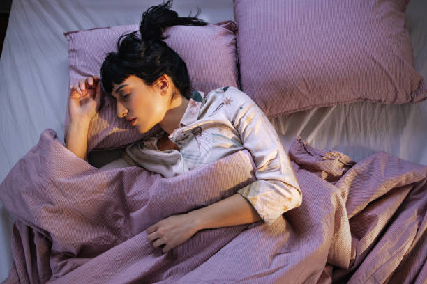 istock Caucasian Woman Sleeping In Her Bed 1402344947