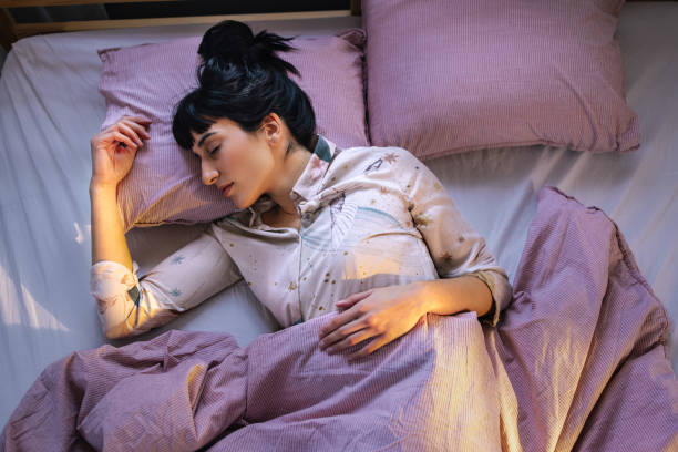 istock Caucasian Woman Sleeping In Her Bed 1402344949