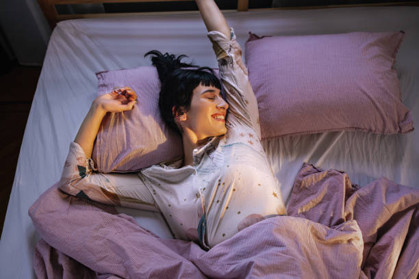 istock Woman Stretching In Bed 1402344952