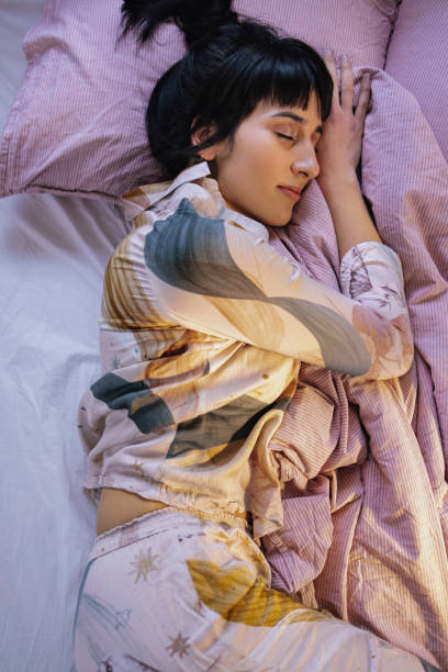 istock Woman Sleeping In Her Bed 1402344955