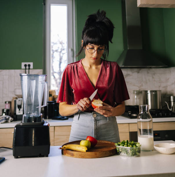 istock Woman Preparing A Healthy Snack 1402344978