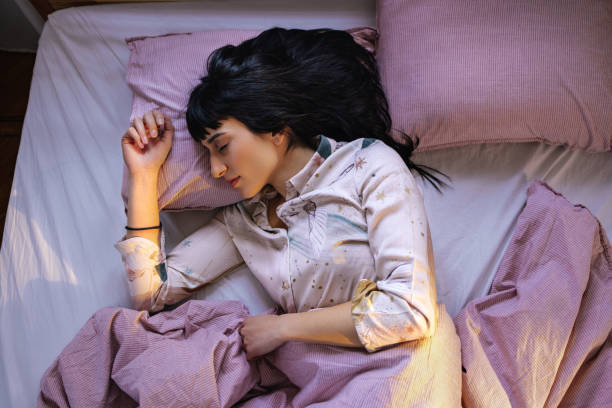 istock Caucasian Woman Sleeping In Her Bed 1402344996