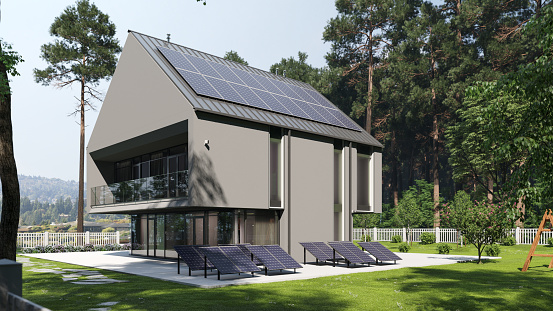 Solar panels on roof and backyard of a luxury house.