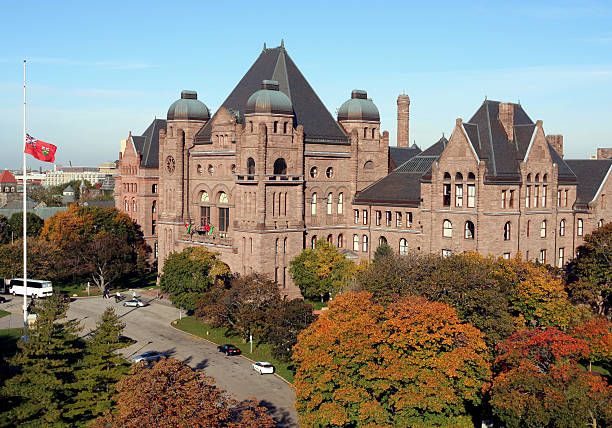 Ontario  Parliament with fall colors Seat of the government of the province of Ontario.  The flag is lowered in mourning for Canadian soldiers killed in Afghanistan. ontario flag stock pictures, royalty-free photos & images