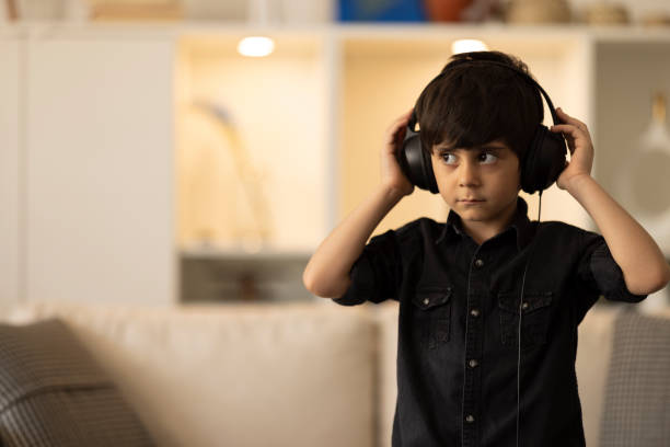 istock Child Rocking Out to Music 1402350763