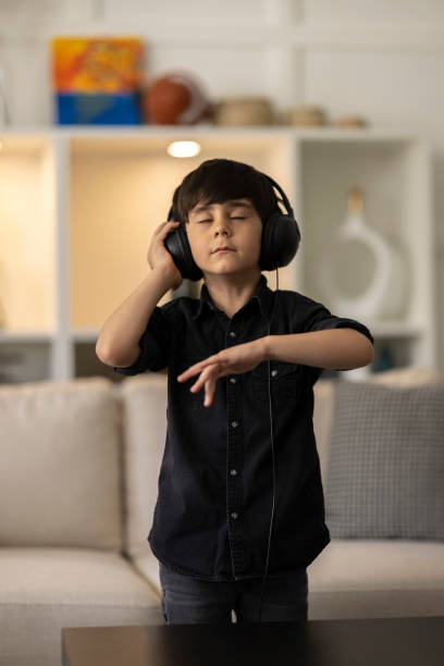 istock Child Rocking Out to Music 1402350894