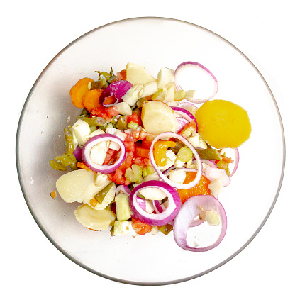 High angle view of salad of vegetables with : slices of carrots,  potatoes, tomato, spanish onion, green bean and celery