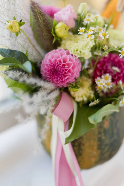 istock Bright fall autumn bouquet in pumpkin 1402352267