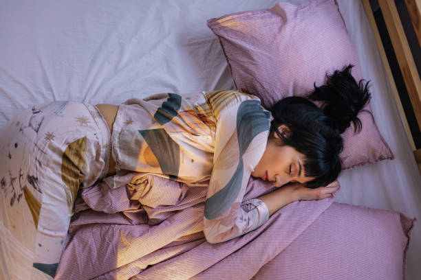 istock Woman Sleeping In Her Bed 1402353301