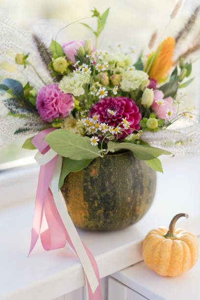 istock Bright fall autumn bouquet in pumpkin 1402354062