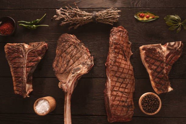 various cooked meats black background