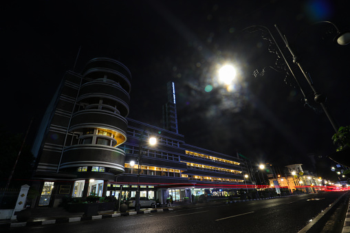 Bandung, West Java, Indonesia - January 10, 2022: The Savoy Homann Bidakara Hotel landscape with light trails at night. It is a historic luxury four stars hotel located on Asia Afrika Street, Bandung,