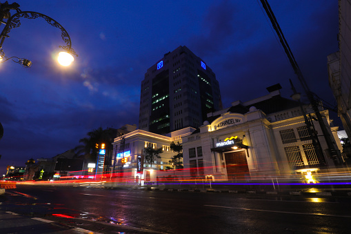 Bandung, West Java, Indonesia - January 10, 2022: The Nedhandel NV building landscape at night with dramatic sky. It's one of historical building in Bandung and located across the Bandung City square.