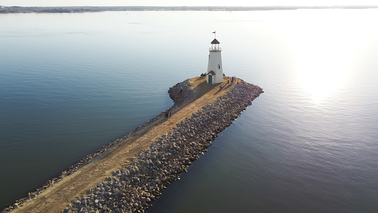 Aerial view beautiful Lighthouse and Lake Hefner in horizontal line, Oklahoma City, America. Sunset at 36 feet tall building inspired by a 1700s New England lighthouse