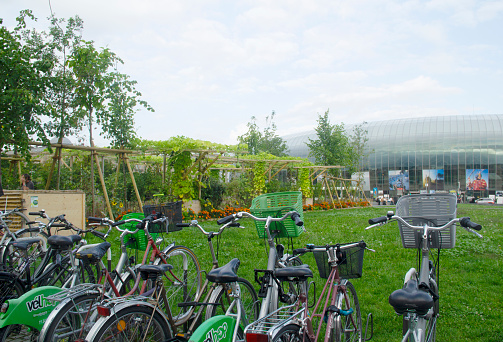 Only Bus Transport and Bicycle Parking Available in Front of the Main Entrance of Gare de Strasbourg, People Crossing the Green Corridor Clear Passage, in Strasbourg City Center, Bas-Rhin, France in August 2021 - Strasbourg-Ville is the main railway station in the city of Strasbourg, Bas-Rhin, France. With over 20 million passengers in 2018, Strasbourg-Ville is one of the busiest railway stations in France. Parking for thousands of bicycles has been made available in Place de la Gare.