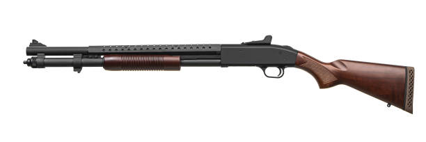 istock Modern pump-action shotgun with a wooden butt and fore-end isolate on a white background. Weapons for sports and self-defense. Armament of police, army and special units. 1402360452