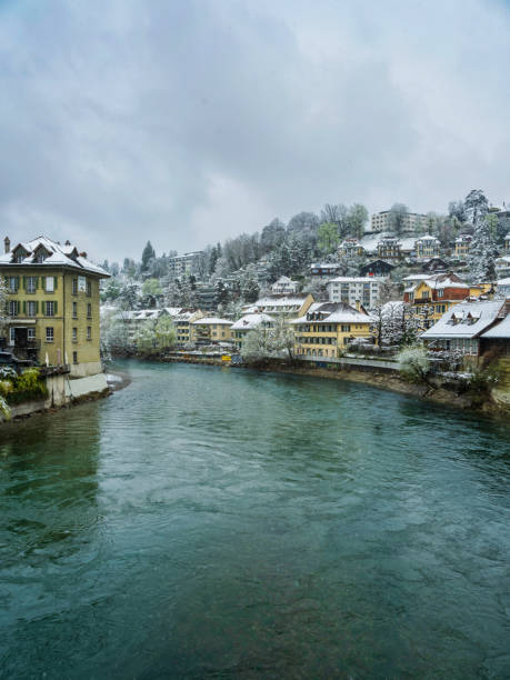 swiss city of bern in river aare during snowfall in bern switzerland - berne berne canton aare river switzerland imagens e fotografias de stock