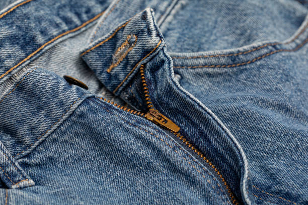 Blue jeans pants and zipper. Diet, weight loss and gain concept. stock photo
