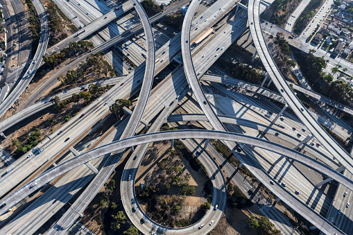 Aerial view of the 110 and 105 freeway interchange ramps and bridges south of downtown Los Angeles in Southern California.