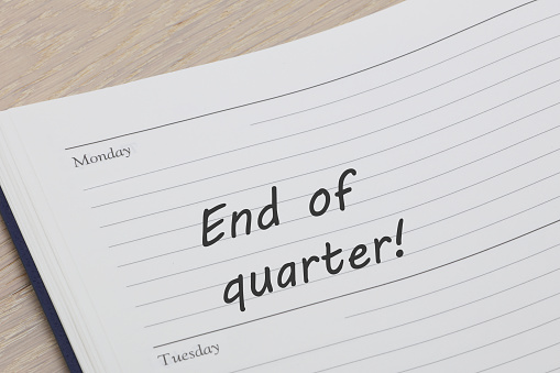End of quarter reminder note in a diary page