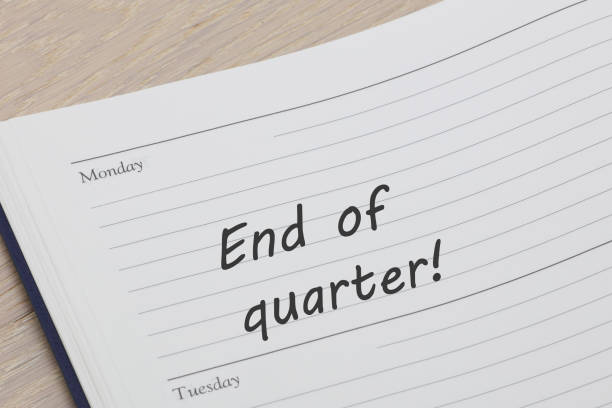 End of quarter reminder note in a diary page An end of quarter reminder note in a diary page quarter stock pictures, royalty-free photos & images