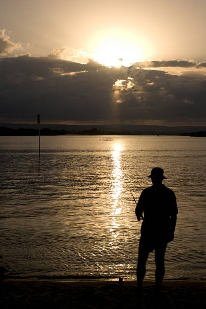 Sunset Fisherman stock photo