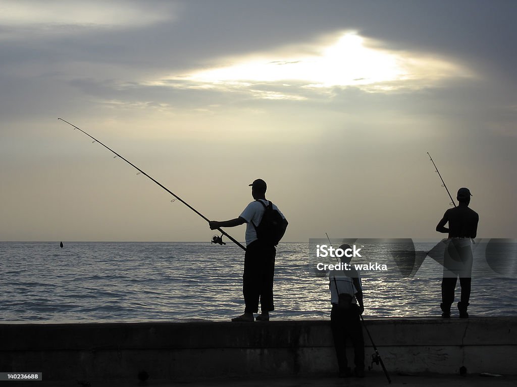 Silhouettes des pêcheurs - Photo de Activité de loisirs libre de droits