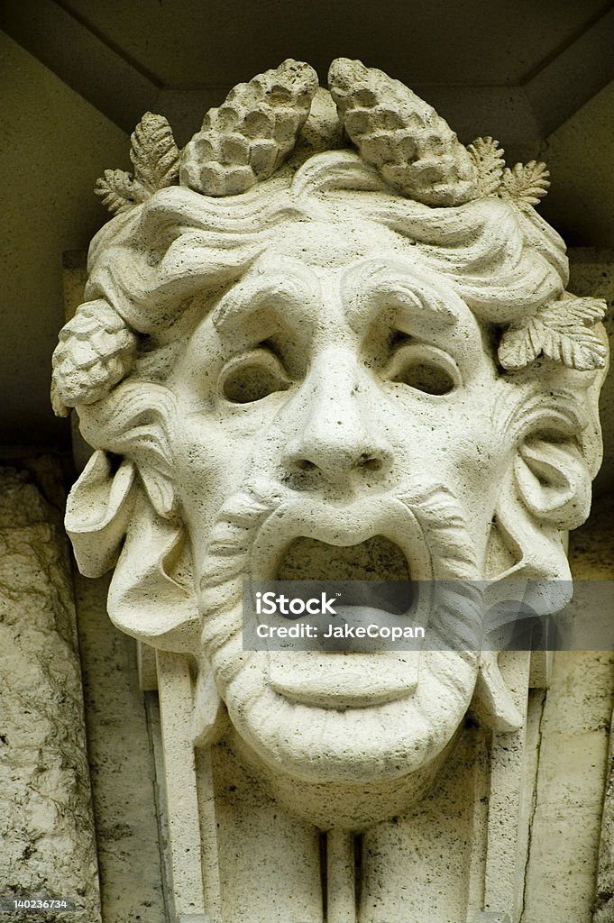 Fear A sculpture on the Volksoper, vienna, austria. Mask - Disguise Stock Photo