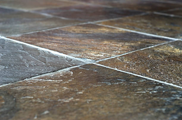 A closeup image of slate tiles and grout stock photo