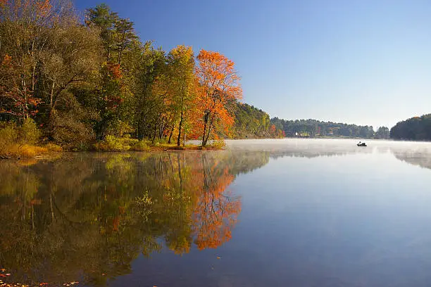 Photo of Calm waters of Sweet Arrow Lake in autumn