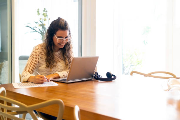istock Young woman working at home. 1402373354