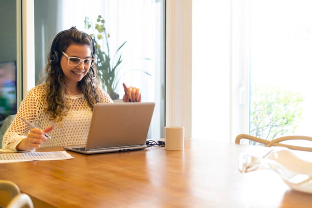 istock Young woman working at home. 1402373575