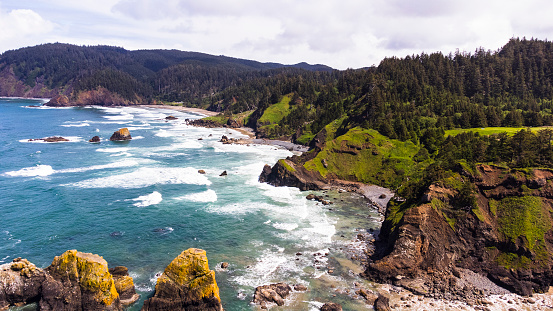 Stock photograph of  the Heceta Head Lighthouse on the Oregon coastline, USA on a sunny evening.