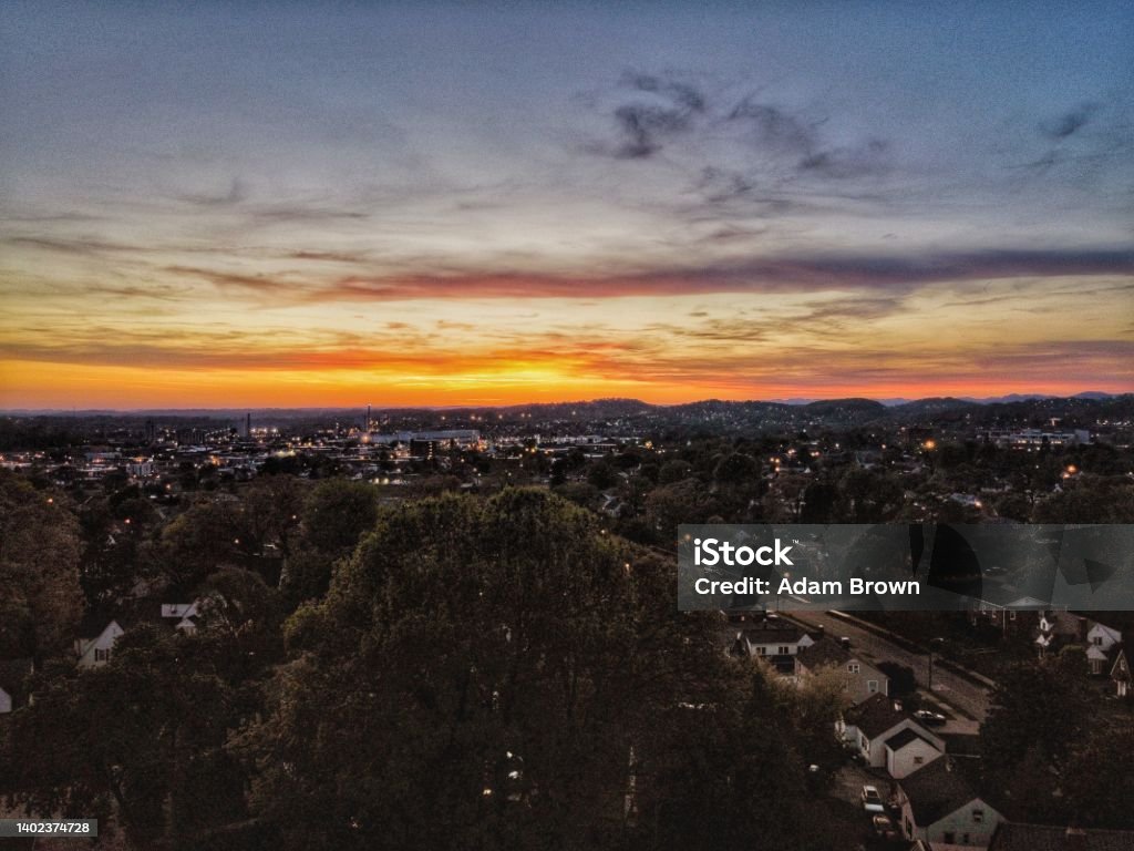 Sunset Over City Drone Photo of a city sunset Aerial View Stock Photo