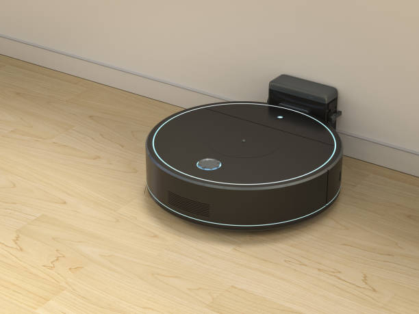 istock Robotic vacuum cleaner or sweeper at charging station 1402379668