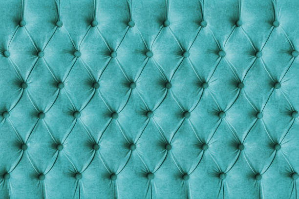 Turquoise capitone velours textile decoration with buttons Turquoise capitone checkered soft fabric textile decorative background with buttons. Classic retro Chesterfield style, luxurious upholstery buttoned texture for furniture, wall, headboard, sofa, couch head board bed blue stock pictures, royalty-free photos & images