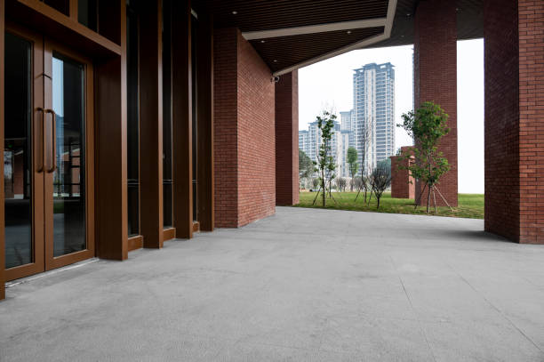 The empty sidewalk by the red wall