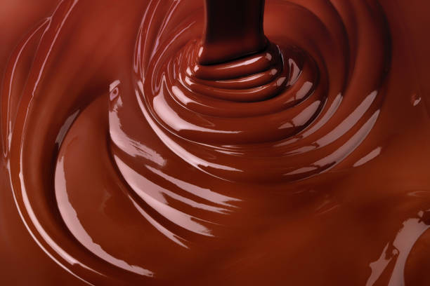 istock melt dark chocolate background. pour liquid cocoa dessert 1402387914