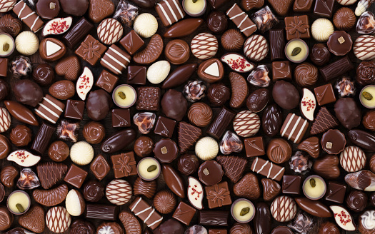 assorted chocolate candy background, sweet food, top view.