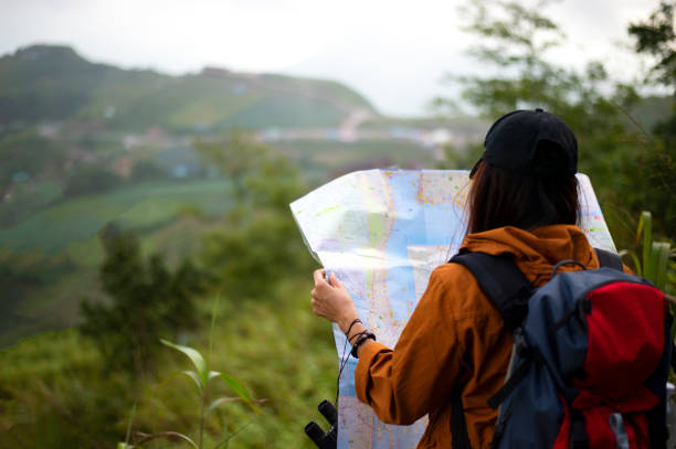 istock Hiker with backpack relaxing young woman hiking holiday 1402391416