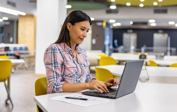 istock Woman working on her laptop at a coworking office 1402396900
