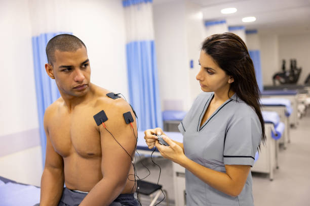 istock Physical therapist applying electrical stimulation on a patient 1402396969