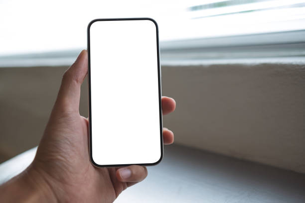 istock Mockup image of a man holding mobile phone with blank white screen in cafe 1402397816
