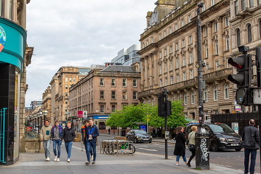 Glasgow, Scotland, United Kingdom - May 3, 2022: Architectural street view of St. Vincent Place area in the downtown district of Glasgow.