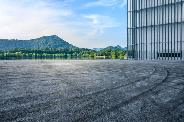 Asphalt road and river with mountain scenery in Hangzhou Asphalt road and river with mountain natural scenery in Hangzhou, China. west lake stock pictures, royalty-free photos & images