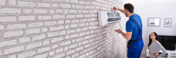 istock Technician Repairing Air Conditioner With Digital Multimeter 1402409819