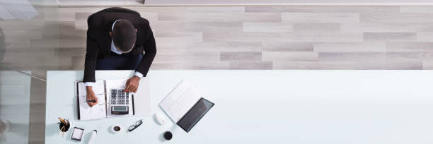 istock Smiling African Businessman Working At Workplace 1402409831