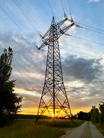 Electric pylon against a dramatic sky.